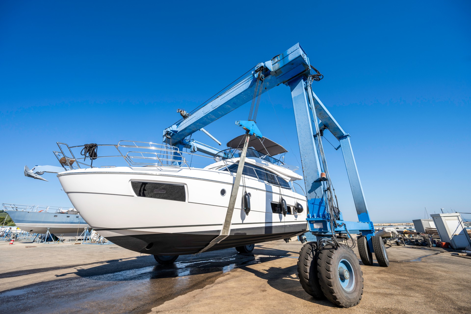 Boat wheel crane elevating motorboat